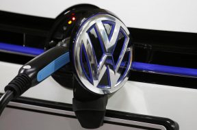 A Volkswagen Golf GTE is being charged during a workshop in Guangzhou