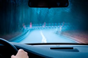 caution – curvy road at night