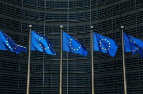 EU flags flutter outside the EU Commission headquarters in Brussels