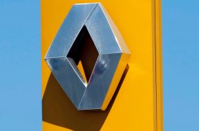 The Renault automaker company logo is displayed on the front of a car dealership in Bordeaux