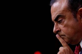 FILE PHOTO – Carlos Ghosn, Chairman and CEO of the Renault-Nissan Alliance, reacts during a news conference in Paris