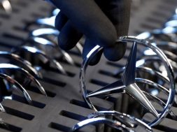 FILE PHOTO: An employee of German car manufacturer Mercedes Benz prepares the company’s logo prior to its installation at the A-class production line at the Daimler factory in Rastatt