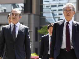 Former Nissan Motor Co. Chairman Carlos Ghosn and his lawyer Junichiro Hironaka arrive at the Tokyo District Court for the first pretrial procedures in his financial misconduct case, in Tokyo