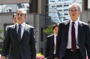 Former Nissan Motor Co. Chairman Carlos Ghosn and his lawyer Junichiro Hironaka arrive at the Tokyo District Court for the first pretrial procedures in his financial misconduct case, in Tokyo