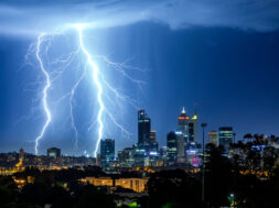 Illuminated Cityscape Against Sky At Night