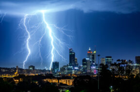 Illuminated Cityscape Against Sky At Night