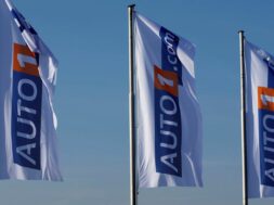 FILE PHOTO: Flags bearing the AUTO1 logo pictured at the company grounds in Zoerbig, Germany