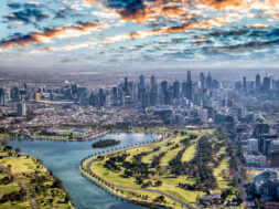Aerial-view-of-Melbourne-with-Albert-Park-and-skyscrapers-Victoria-Australia-_1188575104