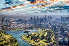 Aerial-view-of-Melbourne-with-Albert-Park-and-skyscrapers-Victoria-Australia-_1188575104