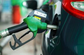 Car refueling on a petrol station in winter closeup (vladstar)