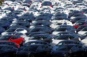 FILE PHOTO: A parking lot of predominantly new Tesla Model 3 electric vehicles is seen in Richmond, California