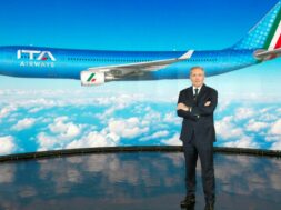 ITA Airways Chairman Alfredo Altavilla poses with the image of the new livery for the carrier’s jets