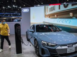December 3, 2021, Nonthaburi, Thailand: A visitor walks past a Audi e-tron GT car displayed at the Motor Expo..The 38th
