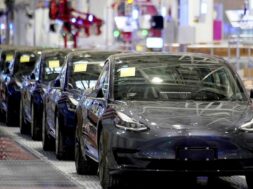 FILE PHOTO: Tesla’s China-made Model 3 vehicles are seen during a delivery event at its factory in Shanghai