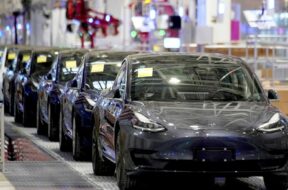 FILE PHOTO: Tesla’s China-made Model 3 vehicles are seen during a delivery event at its factory in Shanghai