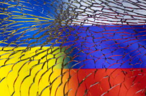 Illustration shows Ukraine and Russian flags through broken glass