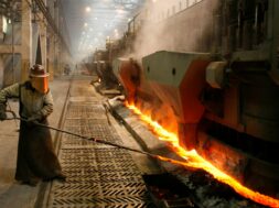 A worker serves an electrolysis furnace in the RUSAL aluminium smelter in Krasnoyarsk