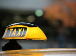 Close-Up Of Yellow Taxi Sign
