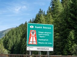 Italy – 8 August 2023: Sign with inscription: Vignette obligation on the highway in the direction of Austria *** Schild