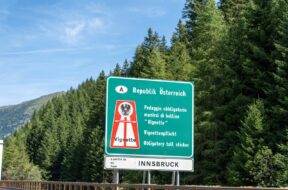 Italy – 8 August 2023: Sign with inscription: Vignette obligation on the highway in the direction of Austria *** Schild